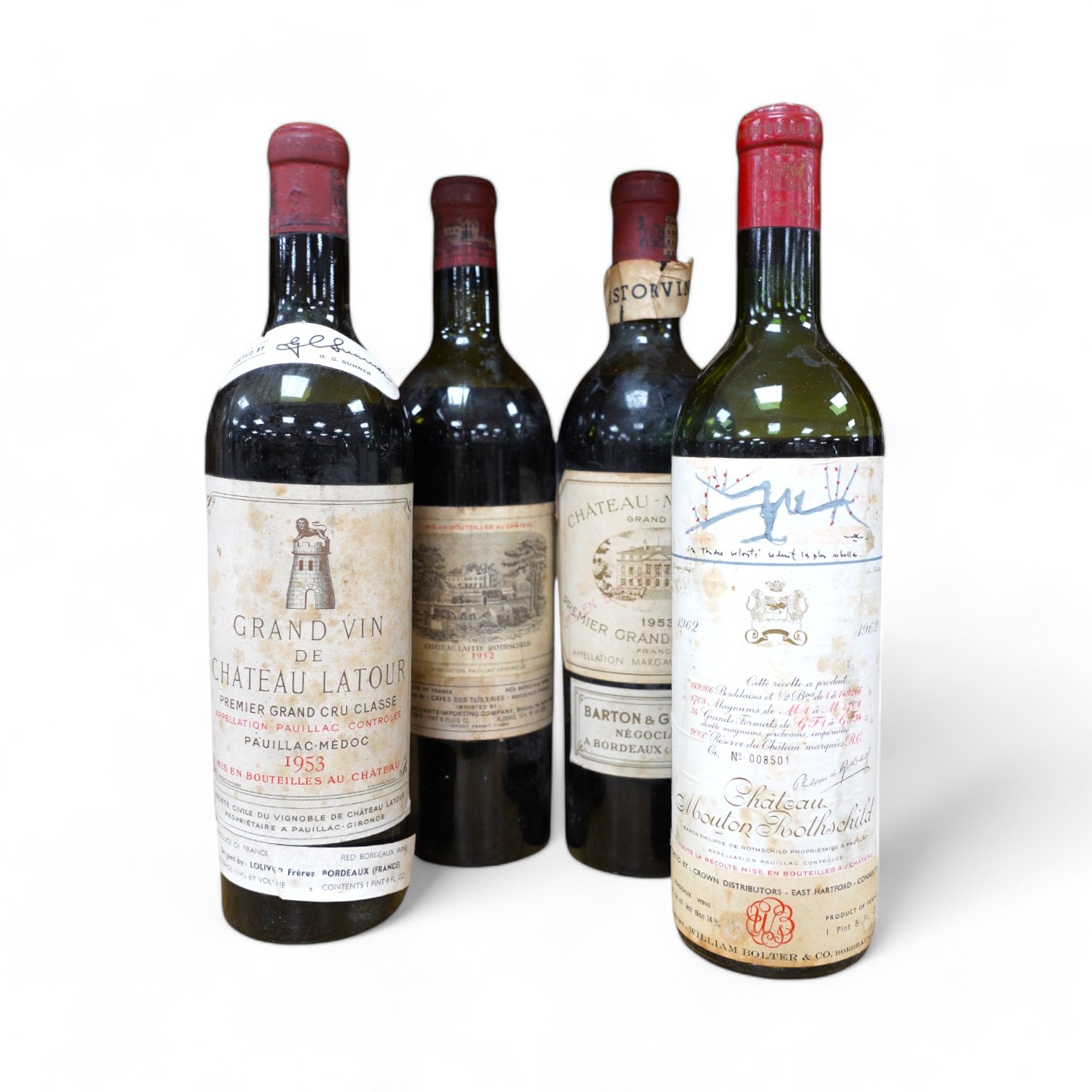 Four bottles of red wine; a Chateau Latour 1953, a Chateau Margaux 1953, a Chateau Mouton Rothschild, 1962, and a Chateau Rothschild 1952. Condition - fair to good, some foxing and peeling etc to labels